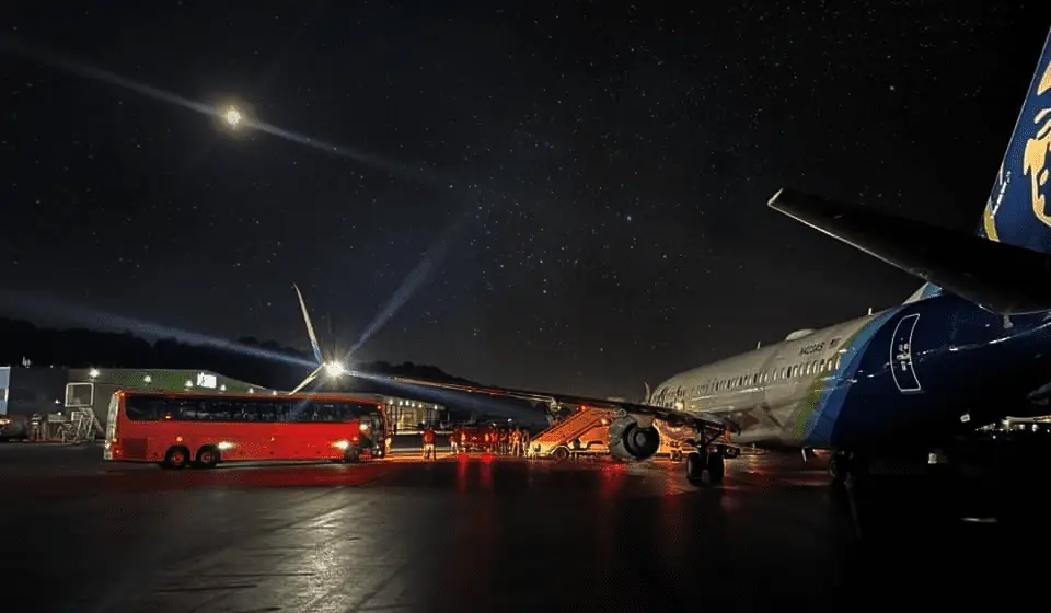 Journey Lines Charter Bus transporting people from airport station to plane