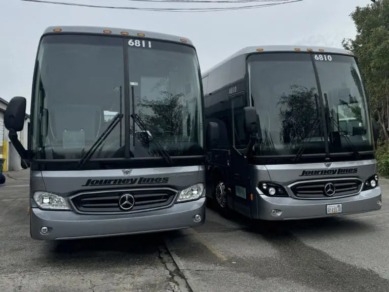 Two of our 56 passenger Mercedes-Benz Charter Buses, freshly cleaned and ready for their next adventure.